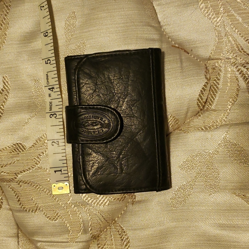 Like new cute navy wallet. Zipper in back. Plenty of space for cards